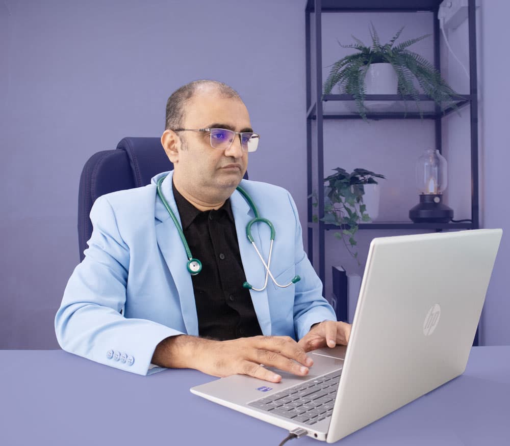 Dr. Chirag Jain working at his desk