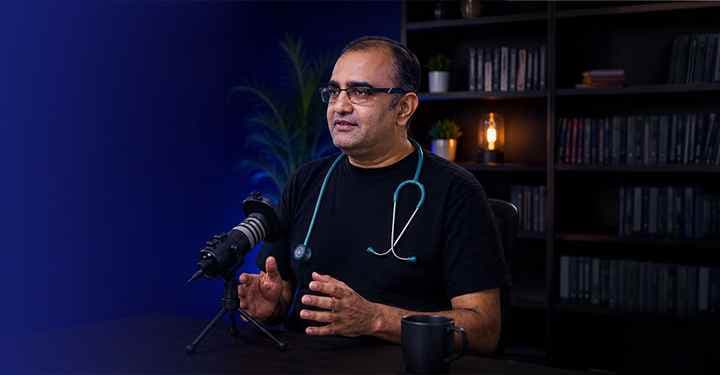 Dr. Chirag Jain recording a medical podcast on cancer anxiety, oncology, and the nervous system